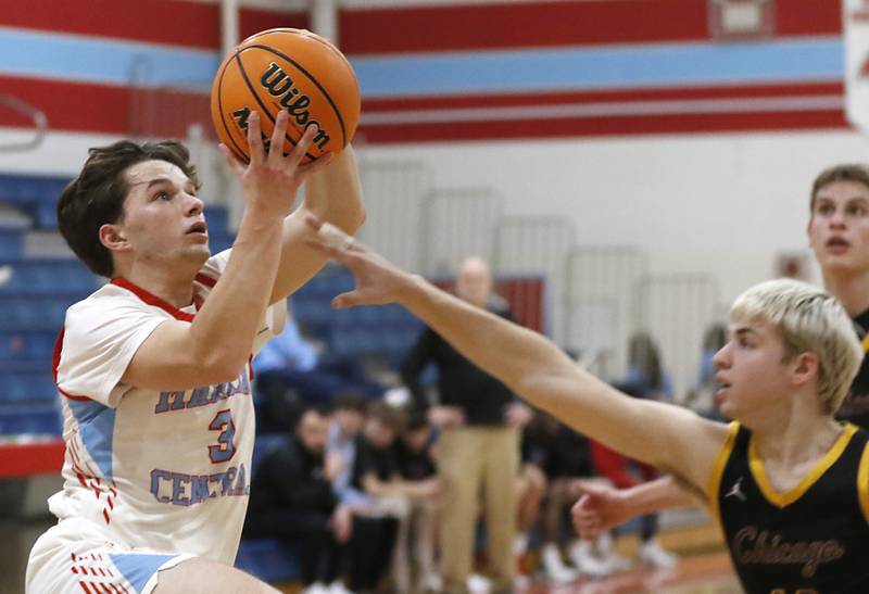 Marian Central's Logan Brandt drives the baseline against tChicago Christian's Malachi Krestel during a Chicagoland Christian Conference basketball game on Tuesday, Jan. 21, 2025, at Marian Central High School.
