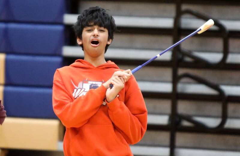 Oswego High School student Guhan Ramesh watches where his golf ball goes during a physical education class at Oswego High School on Monday, March 4, 2024. The class was part of a six-week program collaboration with the U.S. Adaptive Golf Alliance.