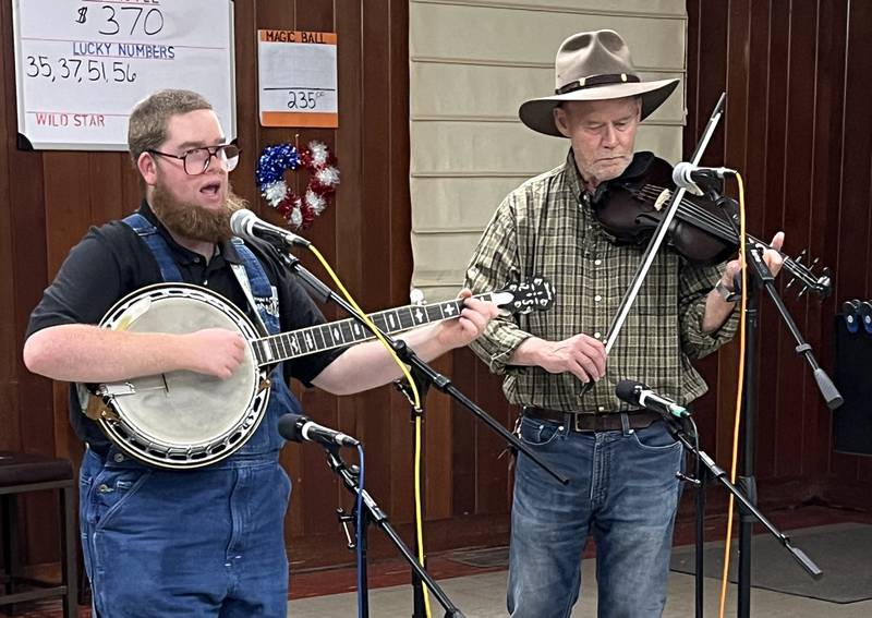 Michael Mott (banjo) and Fred Grant (fiddle) perform at the July First Friday Open Mic in Oregon. The next performance is Friday, Aug. 1 at the Oregon VFW.
