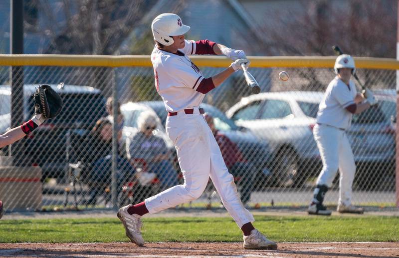 Plainfield North's Kash Koslowski (8) singles against Yorkville during a baseball game at Plainfield North High School on Thursday, April 21, 2022.