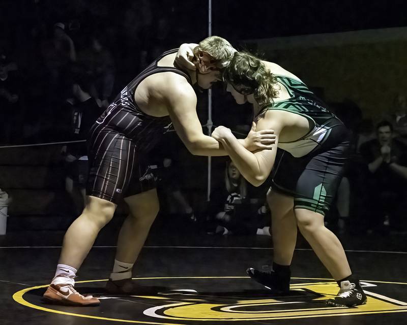 Fulton's Braiden Damhoff (left) and Rock Falls' Jacob Hosler grapple during the 285-pound title bout at the 1A Riverdale Regional on Saturday, Feb. 4, 2023.