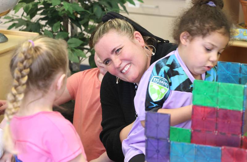 Laurel Copeland, Little Spartans Early Learning Program teacher at South Prairie Elementary School, talks to Jocelyn Walz (left) and Avery Anderson Wednesday, April 6, 2023, at the school in Sycamore.