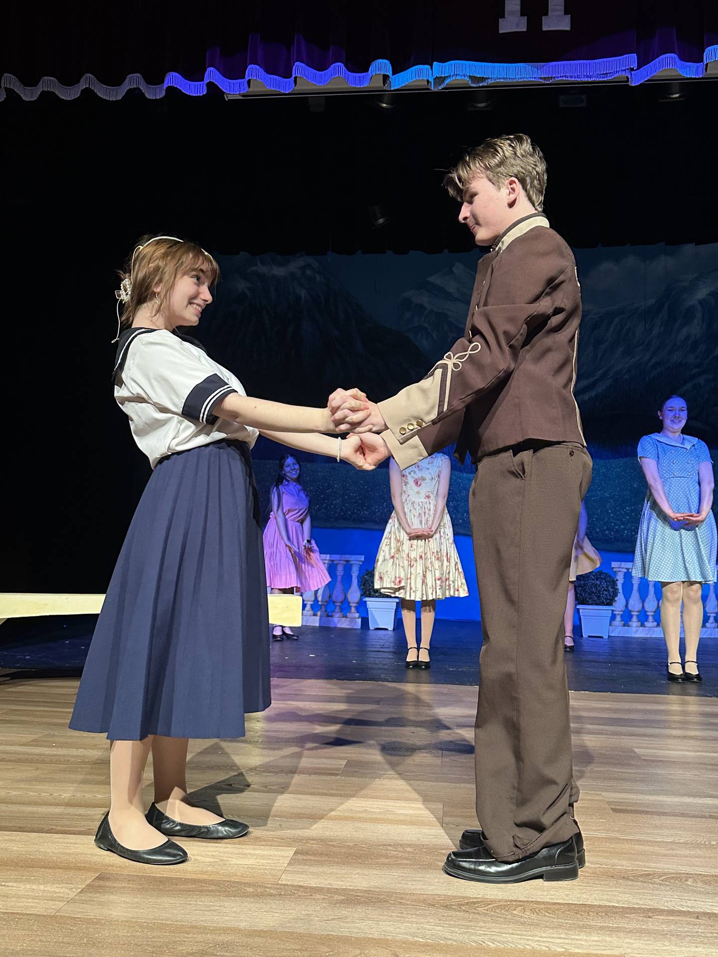 Morris High School students prepare for a song and dance number during a rehearsal of "The Sound of Music."