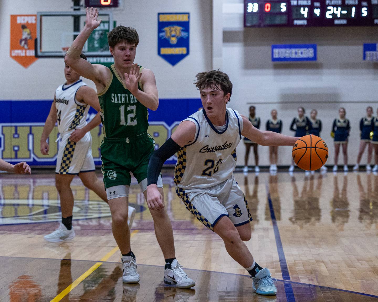 Marquette's Griffin Dobberstein (22) drives ball past St. Bede's Carson Riva (12) during the Class 1A Regional Boys Basketball Championship game on Friday, Feb. 27, 2026 at Serena High School.