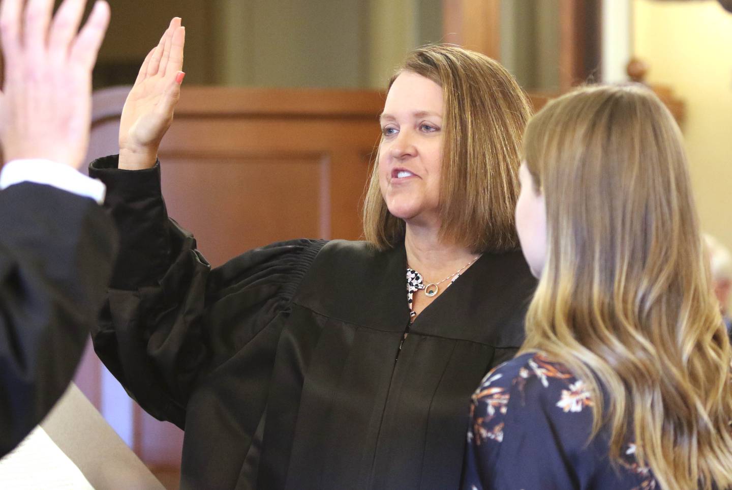DeKalb County Judge Bradley Waller swears in Marcy Buick as a Judge in the 23rd Judicial Circuit Court Friday in Courtroom 300 at the DeKalb County Courthouse as her daughter Alison, 27, looks on. Buick is filling the void left when Judge Robbin Stuckert retired.