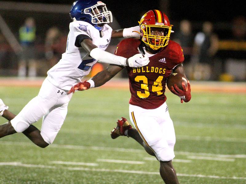 Batavia's Josh Dornink (34) runs the ball during the first game of the season against Phillips in Batavia on Friday, Aug. 27, 2021.
