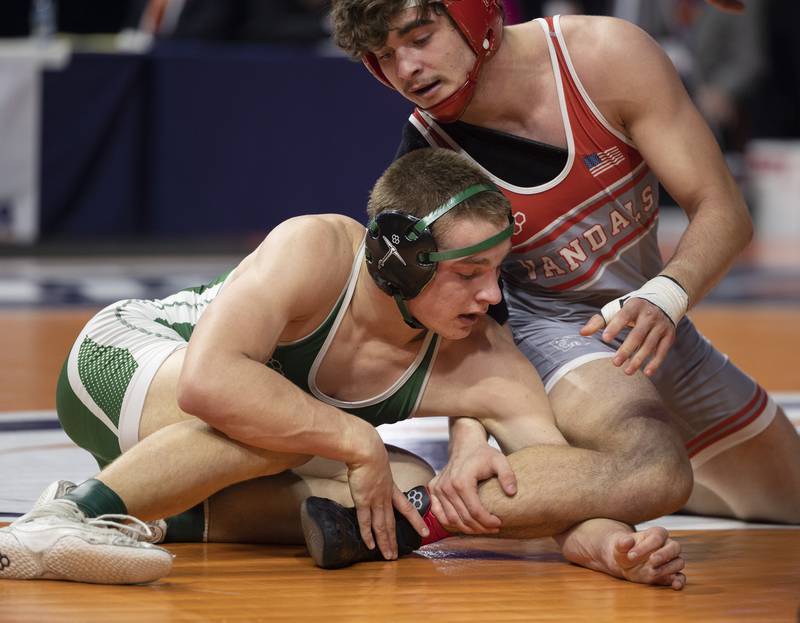 Coal City’s Aidan Kenney works on the leg of Vandalia’s Dillon Hinton in the 1A 157 pound class Saturday, Feb. 21, 2026, at the IHSA wrestling finals in Champaign.