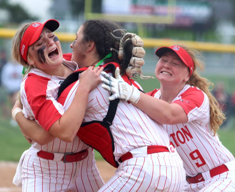 From left, Barrington’s Allie Goodwin, Emma Kavanagh and Brynn Nevers celebrate as the Fillies get the final out during the Class 4A Huntley Sectional championship, Saturday, June 4, 2022.