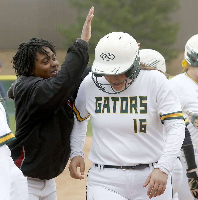 Crystal Lake South's Molly Cook congratulates her teammate, Dana Skorich, after she hit a home run during a Fox Valley Conference softball game Monday, April 25, 2022, between Crystal Lake South  and Jacobs at Crystal Lake South High School.