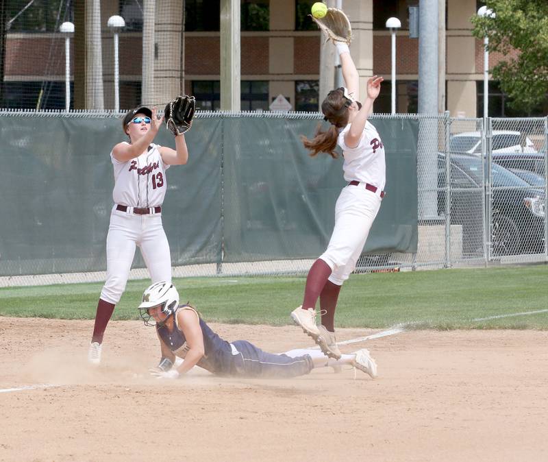 Marquette's Lindsey Kaufmann slides into third base as LeRoy's  during the Class 1A Supersectional game on Monday, May 29, 2023 at Illinois Wesleyan University in Bloomington.