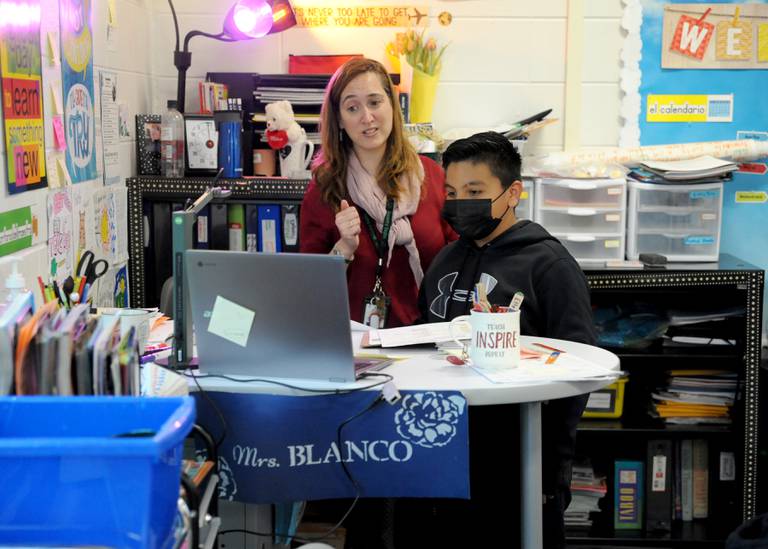Victoria Garcia Blanco and student Eduardo Lopez, 10, answer a question from a student in Spain Wednesday, May 18, 2022, during a fifth-grade dual language class at Coventry Elementary School in Crystal Lake. Garcia Blanco, a native of Spain, organized the exchange to connect the dual language students with students from Colegio Sagrado Corazón de Jesús Vedruna, the school in Spain where she previously taught.
