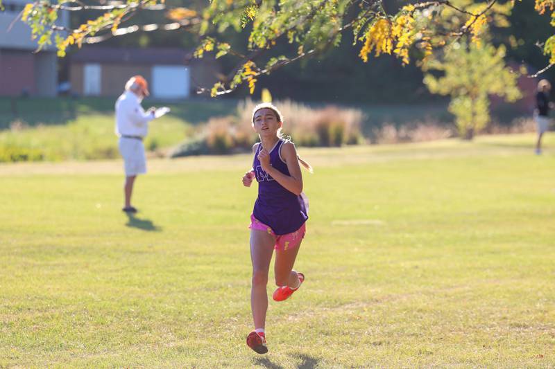 Manteno's Lyla Nevel nears the finish line in third place in the girls 3-mile race during All-Area Cross Country meet on Wednesday, Oct. 8, 2025, at Kankakee Community College.