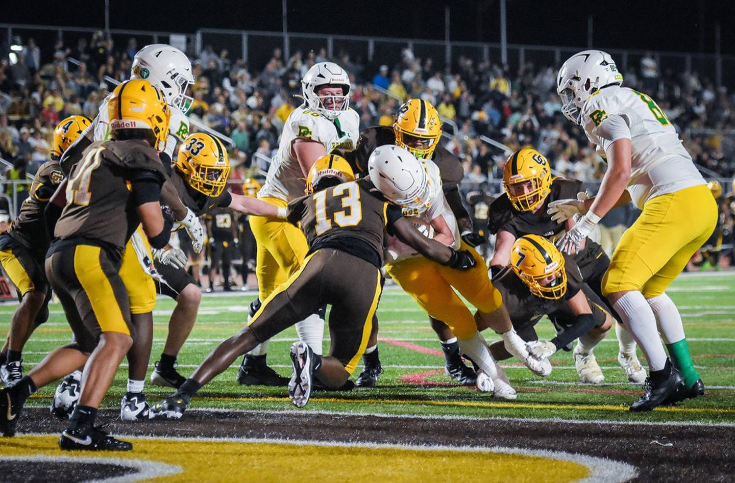 Carmel's Jameer Miles makes a tackle during the team's game against Providence.