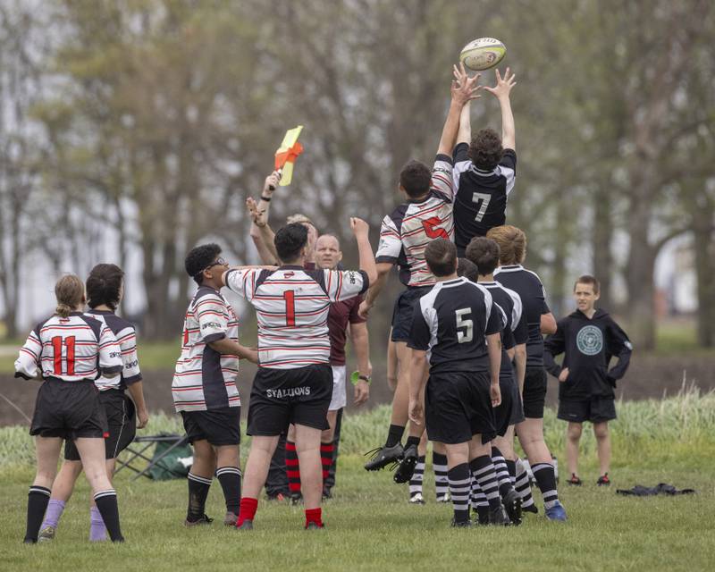 West Suburban Barbarian's Henry Flannagan (7) is lifted by team mates to gain possession of the line in, which resulted from the rugby ball going out of bounds during the game at Veterans Park on April 28, 2024.