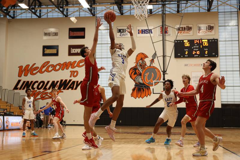 Lincoln-Way East’s Brenden Sanders goes in for the lay up against Hinsdale Central in the Lincoln-Way West Warrior Showdown on Saturday January 28th, 2023.