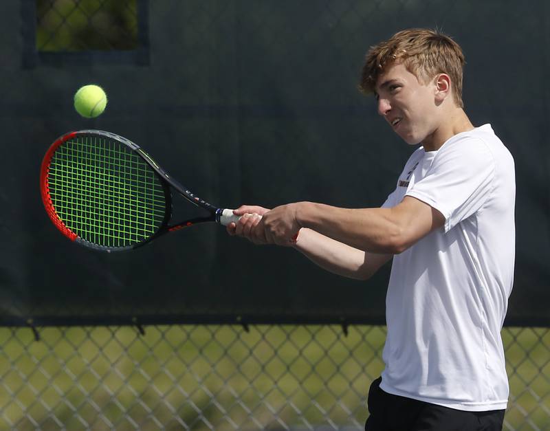 Lyons' Jack McLane returns the ball during an IHSA 2A boys doubles tennis match Thursday, May 25, 2023, at Buffalo Grove High School.