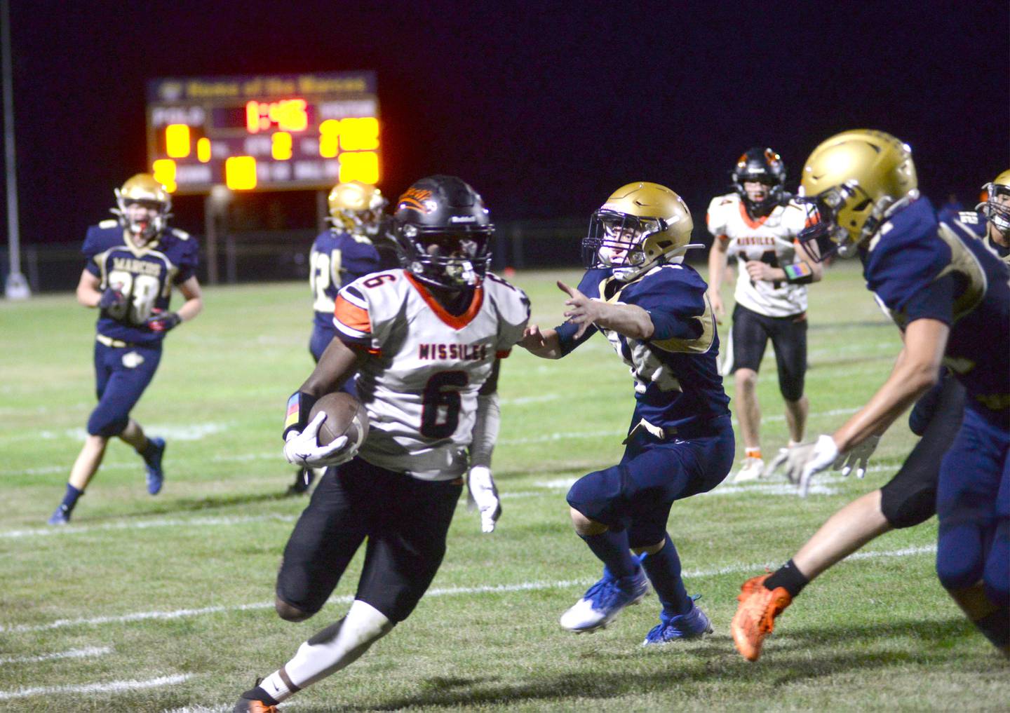 Milledgeville's Micah Toms-Smith (6) runs with the ball as Polo defenders pursue during Friday, Sept. 8, 2023 action at Polo High School.