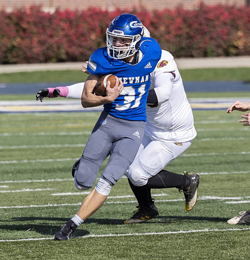 Newman’s Cody McBride looks for running room against ROWVA Saturday, Oct. 28, 2023 in the Class 1A playoffs in Sterling.