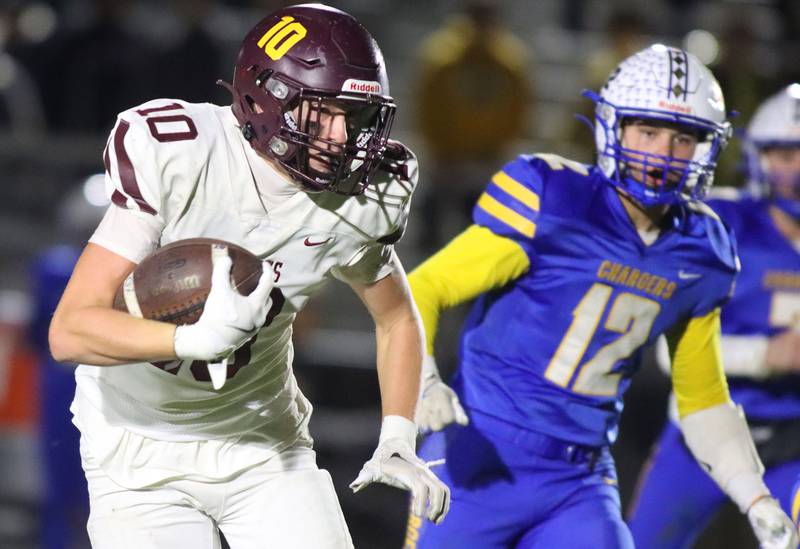 Richmond-Burton’s Luke Robinson runs the ball in IHSA football Class 3A second-round playoff action at Bob Stewart Field on the campus of Aurora Central Catholic High School in Aurora on Friday, November 7, 2025.