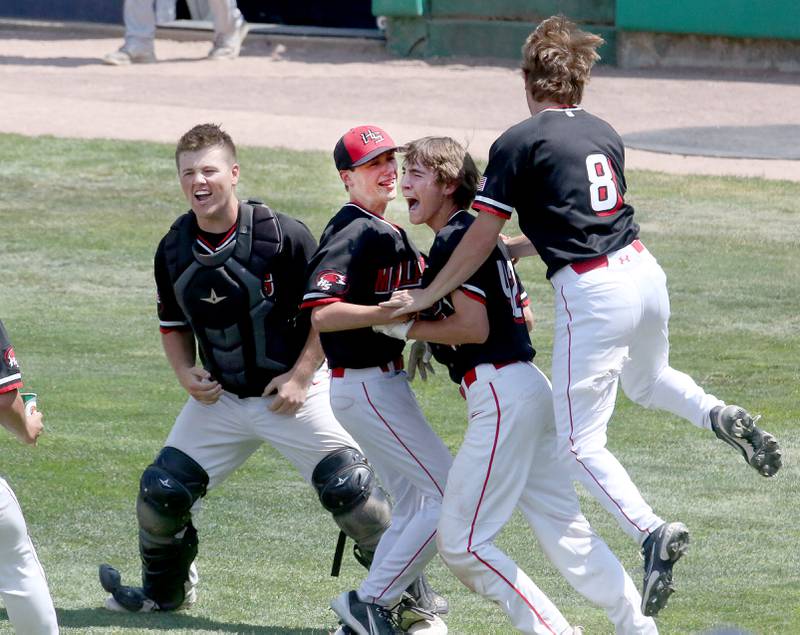 Members of the Henry-Senachwine baseball team meet behind home plate after defeating Newman in the Class 1A State semifinal game on Friday, June 2, 2023 at Dozer Park in Peoria.