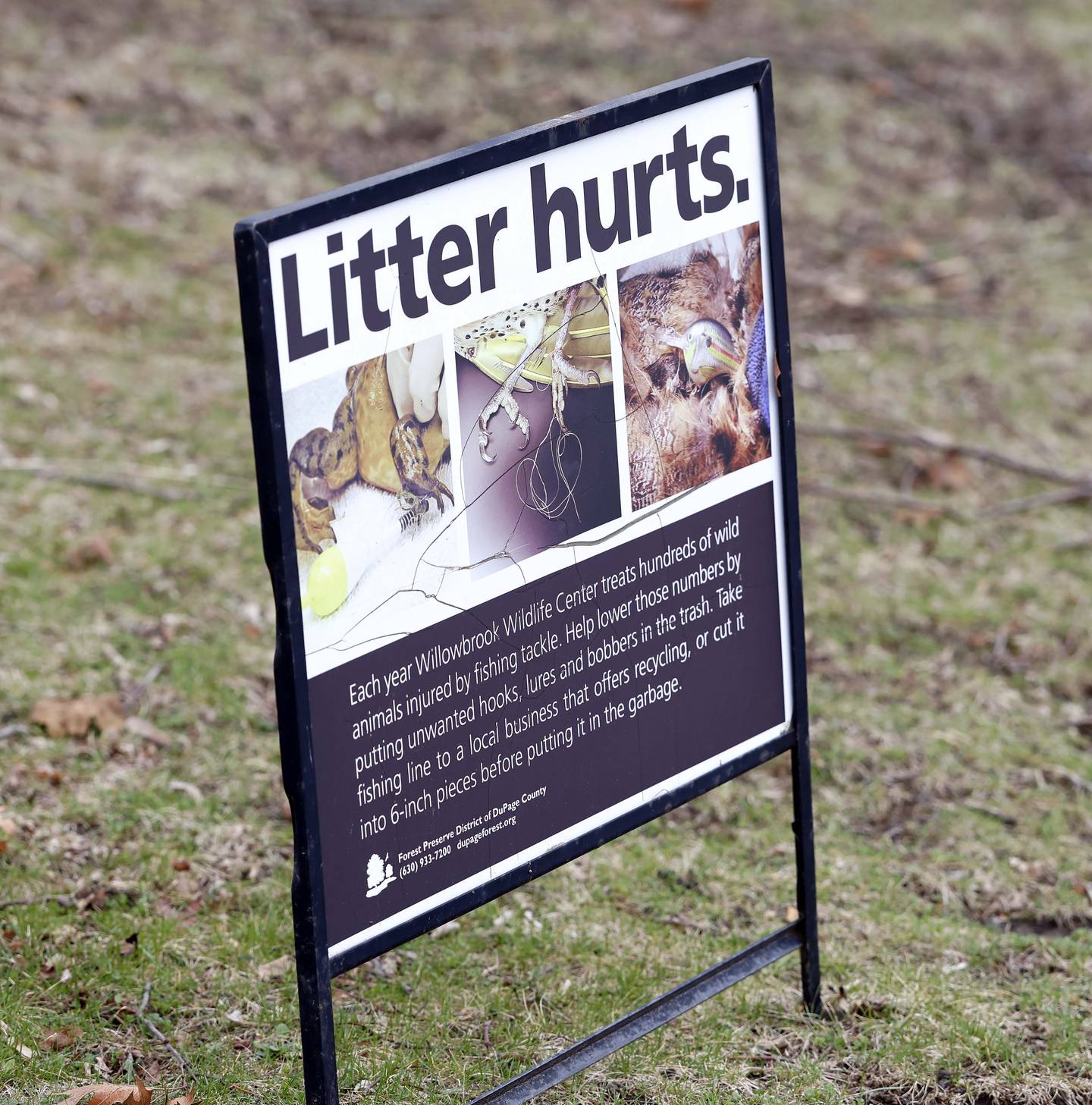A sign encourages anglers to properly dispose of their used fishing line at Blackwell Forest Preserve near Warrenville.