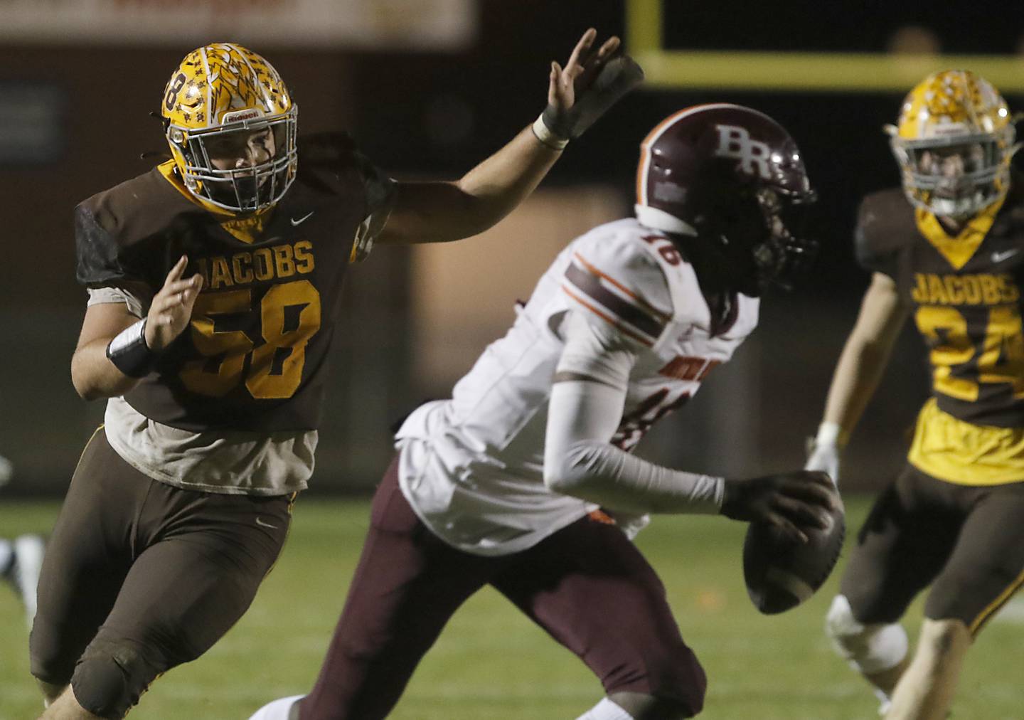 Jacobs' William Seibert chases Brother Rice's Marcus Brown during a IHSA Class 7A first round playoff football game Friday, Oct. 28, 2022, between Jacobs and Brother Rice at Jacobs High School in Algonquin.