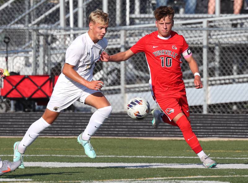Sycamore's Paxton Runkle (left) and Yorkville's Wyatt Panczuk go after a loose ball Thursday, Aug. 28, 2025, during their game in the Barb Cup tournament at DeKalb High School.