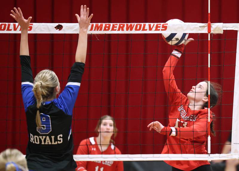Indian Creek's Abby Keilman tries to spike the ball by a Hinkley-Big Rock block attempt during their match Tuesday, Sept. 9, 2025, at Indian Creek High School in Shabbona.