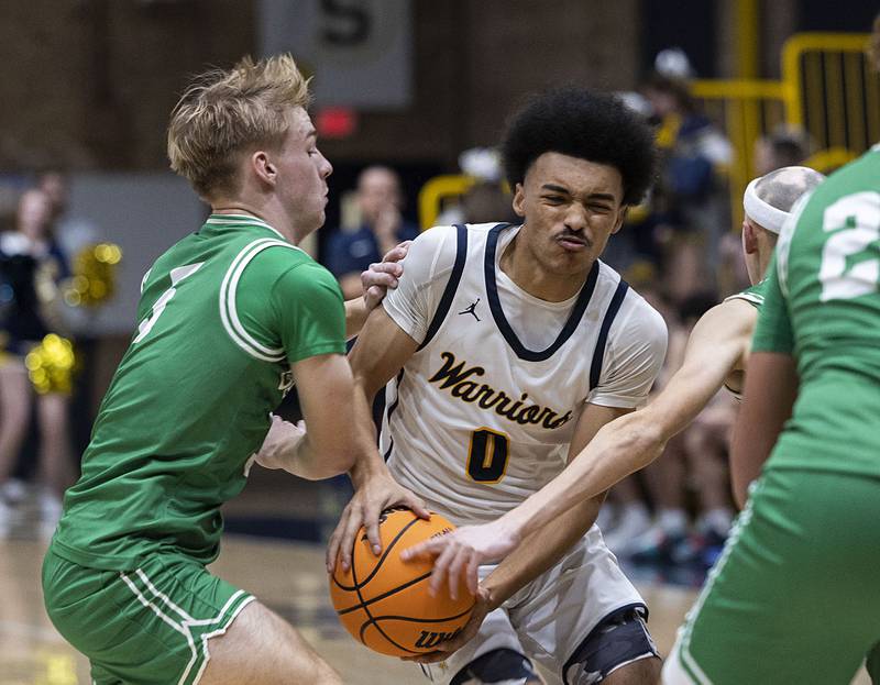 Sterling’s Xavian Prather handles the ball against Geneseo’s Noah Arnold Friday, Dec. 5, 2025.