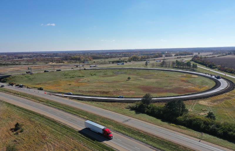 Crews pave the eastbound ramp at the Interstate 80 and I-39 interchange on Wednesday, Oct. 26, 2022 near La Salle. Illinois Department of Transportation has closed different ramps for the patching and shoulder reconstruction. The ramp work is part of a larger construction project to patch 36 miles of I-39 throughout La Salle County.