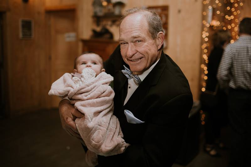 Bob Palkon of Joliet is seen with his granddaughter Daisy on Saturday, March 28, 2026, on his daughter Mary Kate's wedding day.