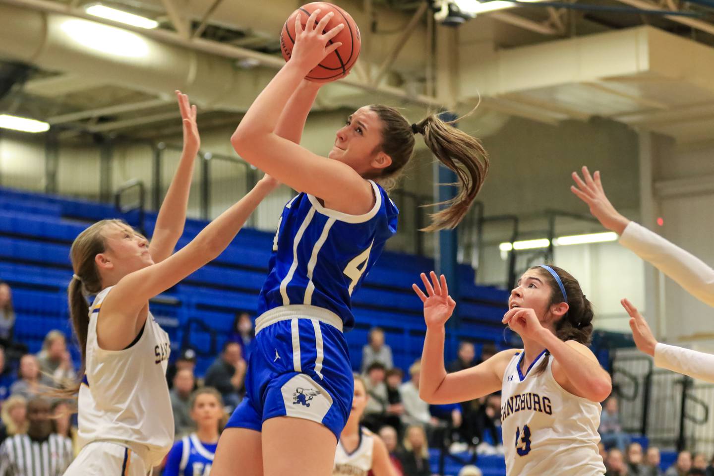 Lincoln Way East's Hayven Smith (44) grabs a rebound during the Sandburg Holiday Invite Championship basketball game between Lincoln Way East versus Sandburg.  Dec 28, 2022.