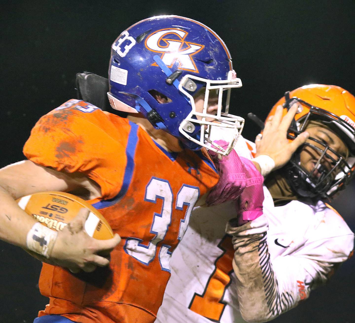 Genoa-Kingston's Chase Engel stiff arms Bogan's Kavon Garland Friday, Oct. 29, 2021, in Genoa during their IHSA Class 4A playoff opener.