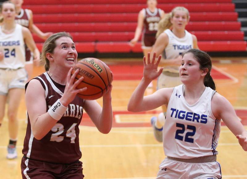 Morris's Makenna Boyle eyes the hoop while running in for a layup against Princeton's Camryn Driscoll during the Lady Pirate Holiday Tournament on Wednesday, Dec. 20, 2023 in Kingman Gym.