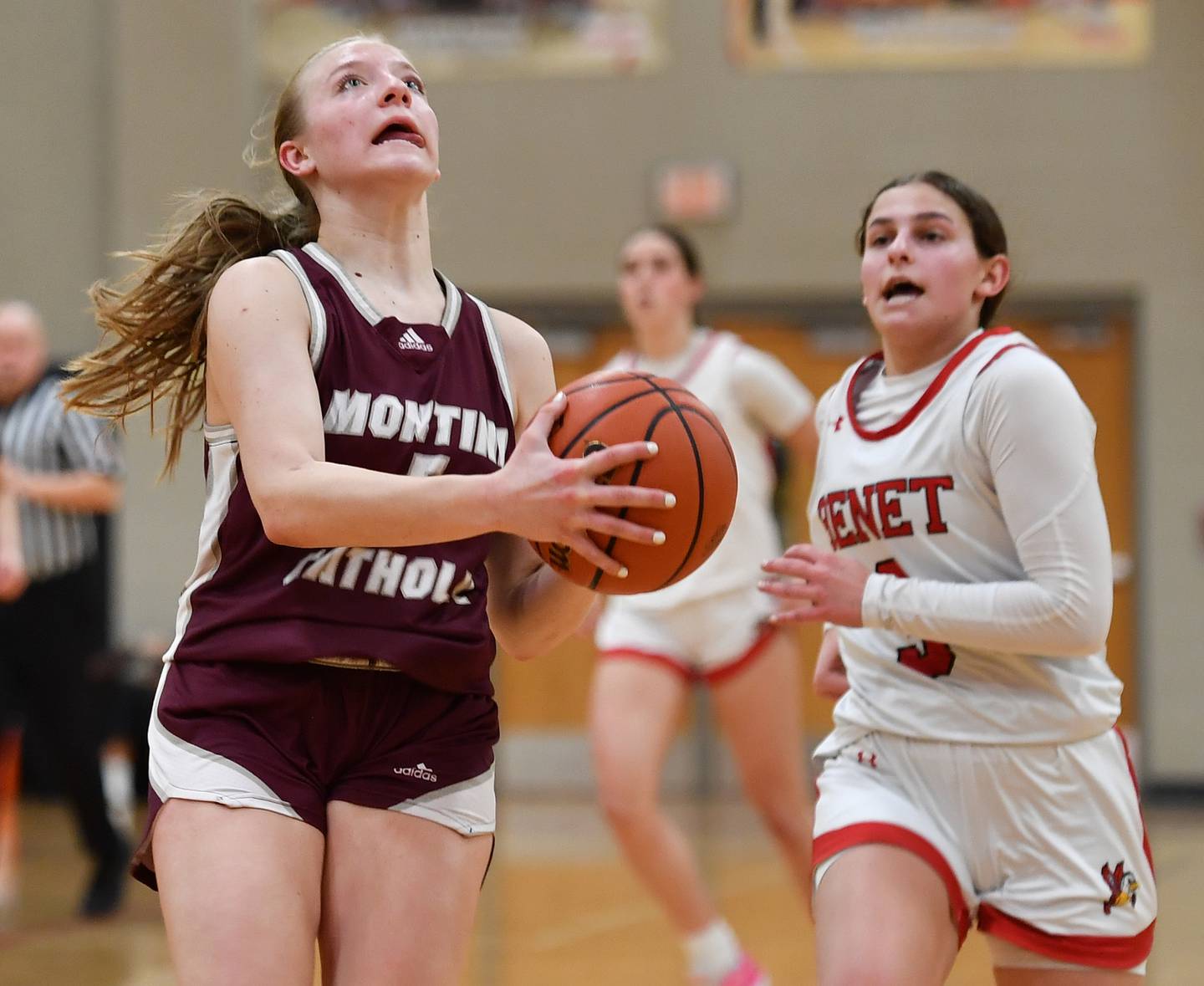 Montini's Victoria Matulevicius starts a layup as Benet's Aria Mazza (right) tries to catch up during a game on Feb. 5, 2024 at Benet Academy in Lisle.