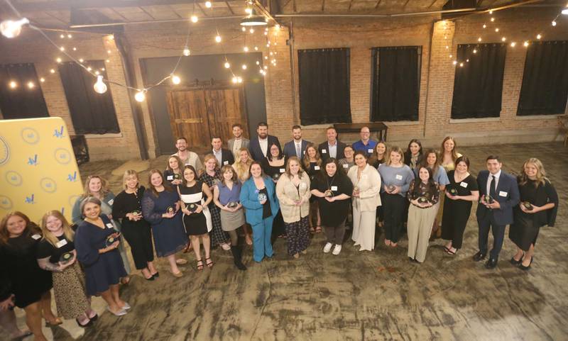 The 40 Under Forty award winners pose for a group photo during the Illinois Valley Chamber of Commerce Champions of Change Awards Night on Wednesday, May 6, 2026 at the Westclox Event Center in Peru.