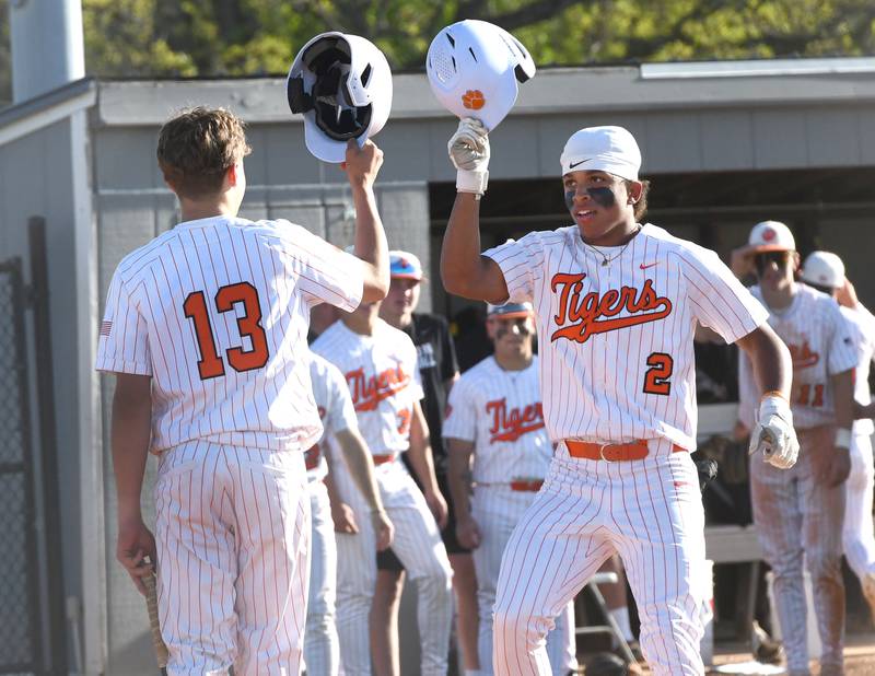 Byron's JJ Edmonson (2) celebrates his home run with Evan Fuller (13) as he steps on home plate against Dixon in a  Big Northern Conference game in Byron on Monday, May 11, 2026.