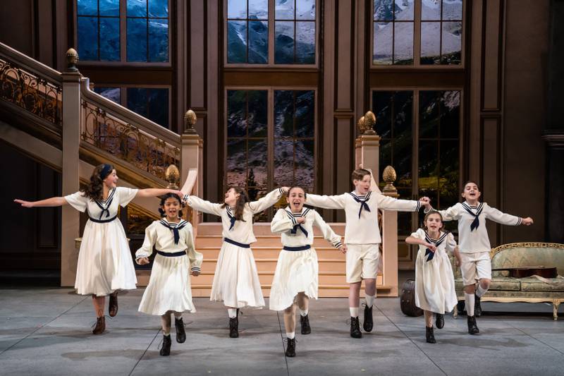 The von Trapp children - (from left) Julia Aragon as Liesl, Savannah Lumar as Marta, Maddie Morgan as Louisa, Milla Liss as Brigitta, Gage Richey as Friedrich, Ava Barabasz as Gretl, and Ezekiel Ruiz as Kurt - in Paramount Theatre’s holiday season production, The Sound of Music. Rodgers and Hammerstein’s beloved musical runs November 9, 2022-January 14, 2023 at Paramount Theatre, 23 E. Galena Blvd. in downtown Aurora. Tickets: paramountaurora.com or (630) 896-6666. Credit: Liz Lauren. Note: this children’s cast rotates performances with a second children’s company, plus a third set of understudies, in Paramount’s The Sound of Music.