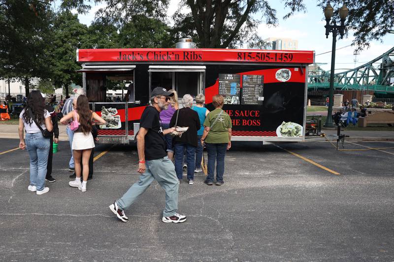 Customers line up at the Jack’s Chick’n Ribs food truck at the 6th Annual Joliet Blues Festival on Saturday, Aug. 10, 2024 at Bicentennial Park.