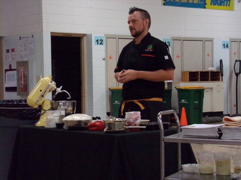 US Foods chef Matt Dean walks students step-by-step through the process of making a homemade pizza Wednesday, June 22, 2022, at Northlawn School in Streator during the University of Illinois Extension's Illinois Junior Chefs program.