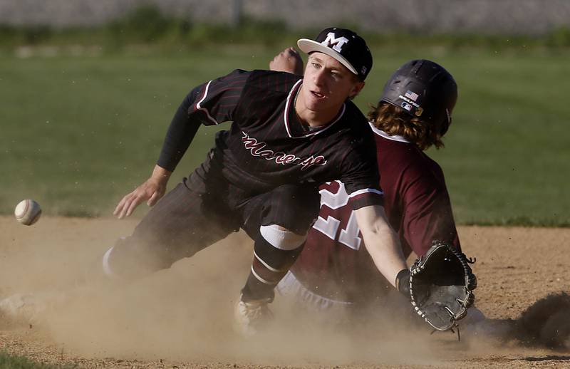 Richmond-Burton's Gavin Busa slides into second base in front of the throw to Marengo's Quinn Lechner during a Kishwaukee River Conference baseball game on Thursday, April 25, 2024, at Marengo High School.