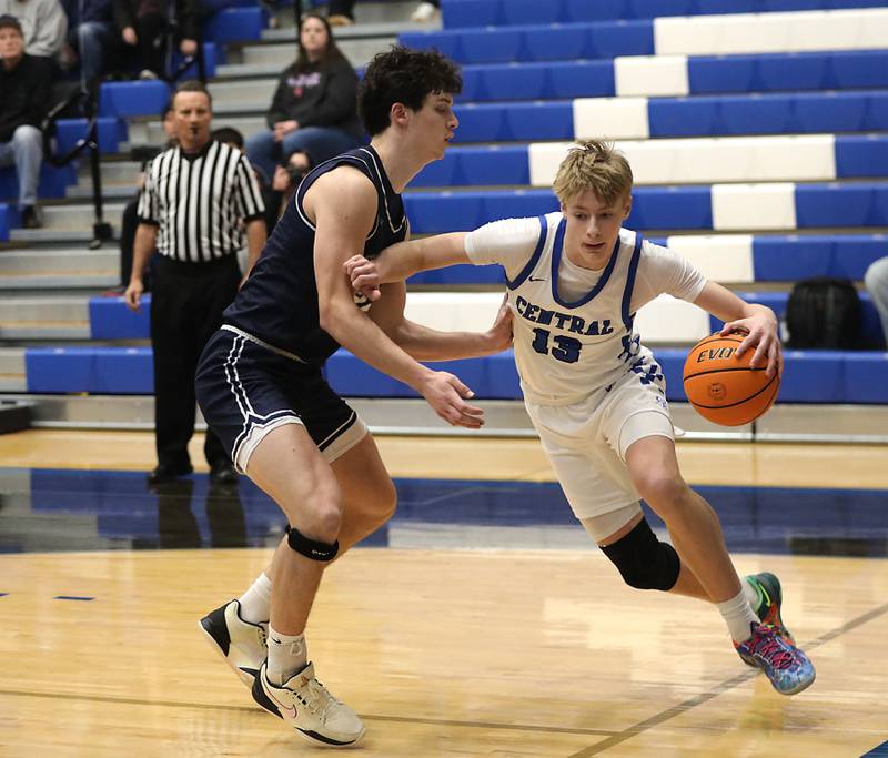 Burlington Central's Declan Wilson drives the baseline against Cary-Grove's Adam Bauer during a Fox Valley Conference boys basketball game on Friday, February. 6, 2026, at Burlington Central High School.