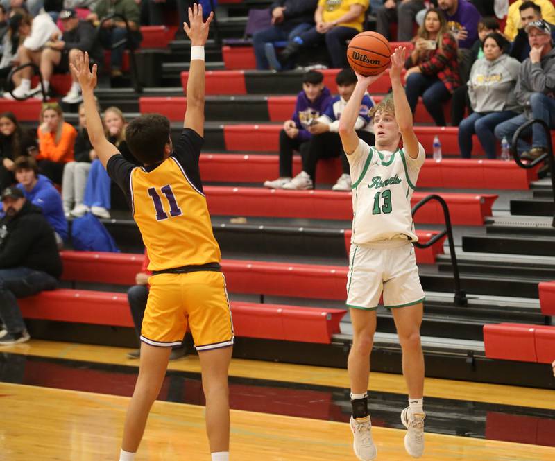 Rock Falls's Aydan Goff sinks a three-point basket over Mendota's Iziah Nenez during the 49th annual Colmone Classic on Friday, Dec. 8, 2023 at Hall High School.