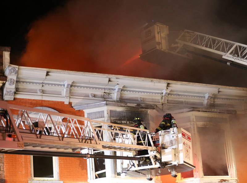 Firefighters extinguish flames from a structure fire at 708 Illinois Avenue on Friday, Dec. 30, 2022 downtown Mendota.