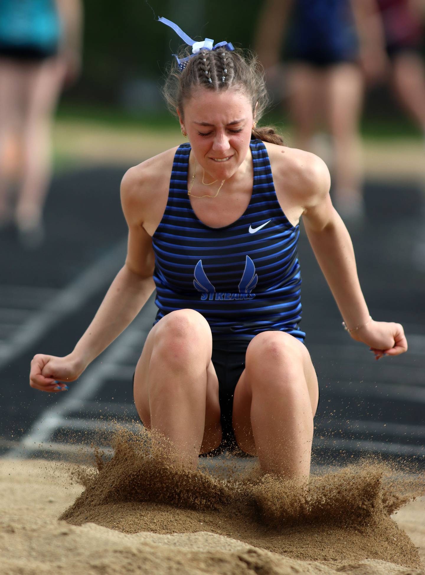 Woodstock’s Mia Foss competes in the long jump during KRC Conference Track Meet action at Marengo High School in Marengo on Tuesday, May 6, 2025.
