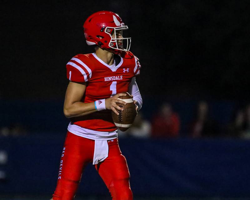 Hinsdale Central's Benjamin Monahan (1) looks for an open receiver during football game between Hinsdale Central at Lyons.  Sept 8, 2023.