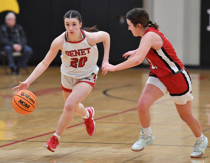 Benet’s Sailer Jones sails past Marist’s Grace Harmon during a game on January 8, 2025 at Benet Academy in Lisle.