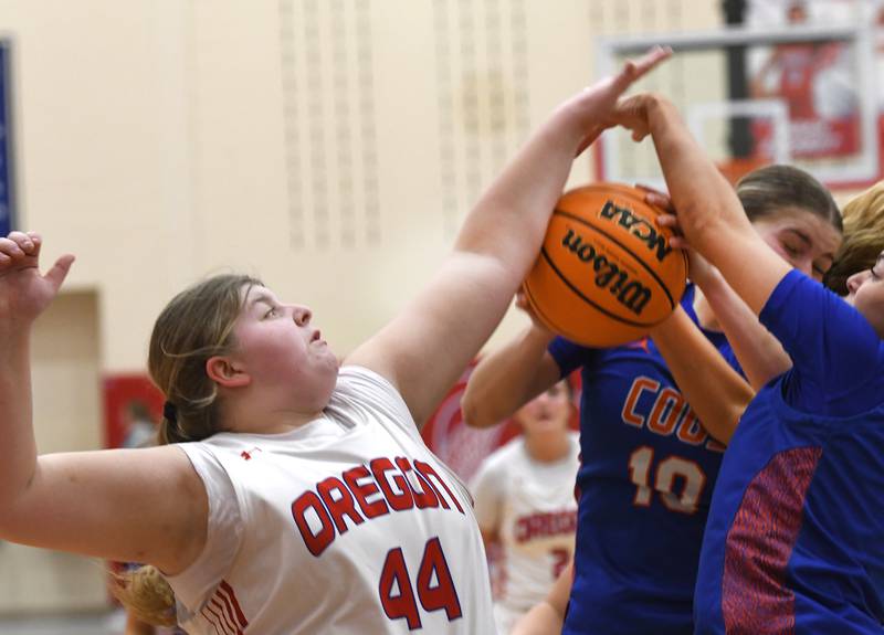 Oregon's Noelle Girton (44) battles Genoa-Kingston's Arielle Rich (10) on Friday, Jan. 30, 2026 at the Blackhawk Center.