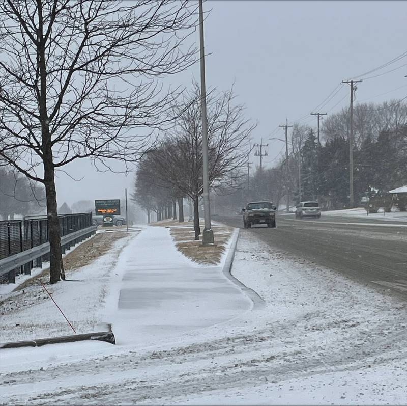 Drivers on Caton Farm Road near the Essington Road intersection navigated the snowy mixture falling down in Joliet on Wednesday, Feb. 12, 2025