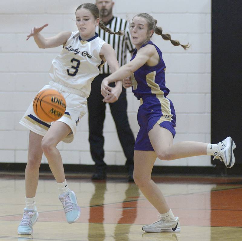 Serena’s Macy Mahler knocks the ball away from Marquette’s Morgan Nelson during the 1st period Saturday at Flanagan.